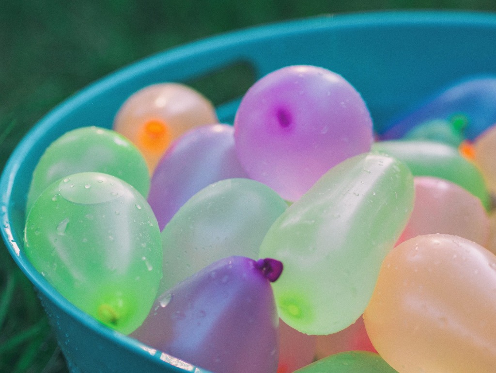 water balloons in a blue container